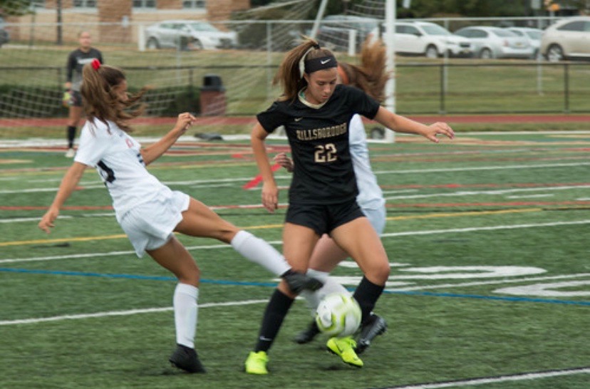 Senior Alexa Swetz fights for the ball in a recent contest.