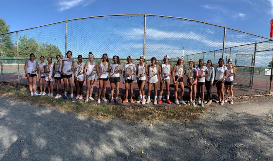 The HHS tennis team lines up before the 2019 Old Timers Tournament.