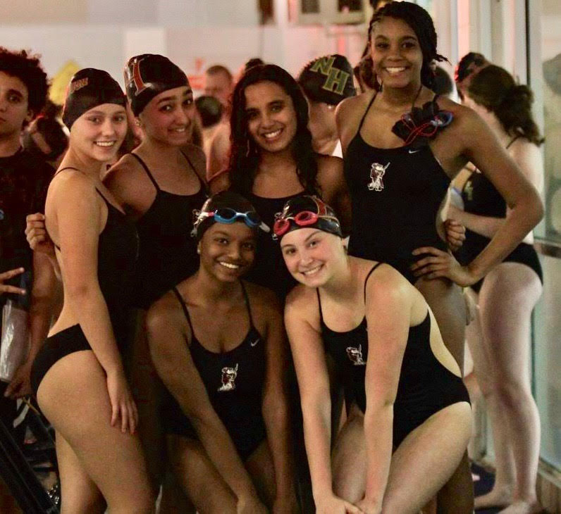 Annalisa Roarty (top left), Diya Rahul, Ananya Madhira, Ciara Dixon, Diys Kalava (bottom left) and Julianna Bongiovanni pose after a swim meet.