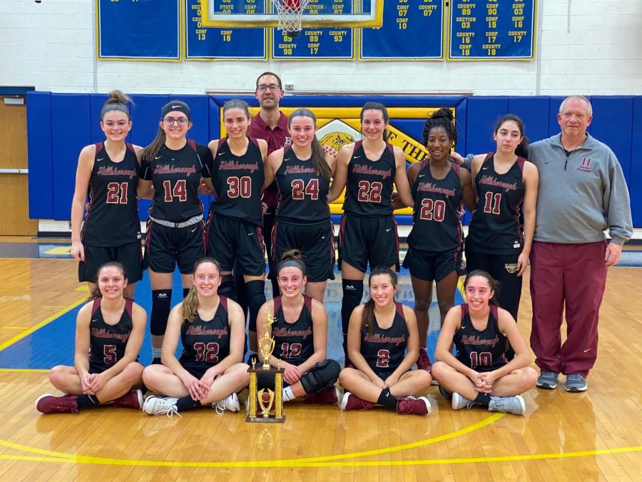 Hillsborough's Lady Raiders pose after to winning the holiday tournament.