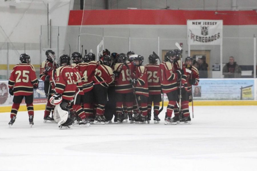 The team huddles on Senior Night before defeating Manalapan.