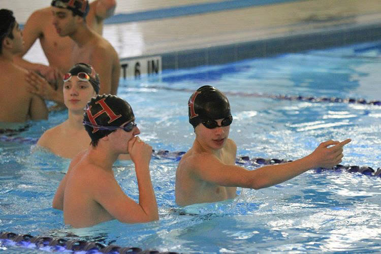 Freshman  Joe Westhusin (left) and sophomore Avinav Bhuyan (right) in the pool.