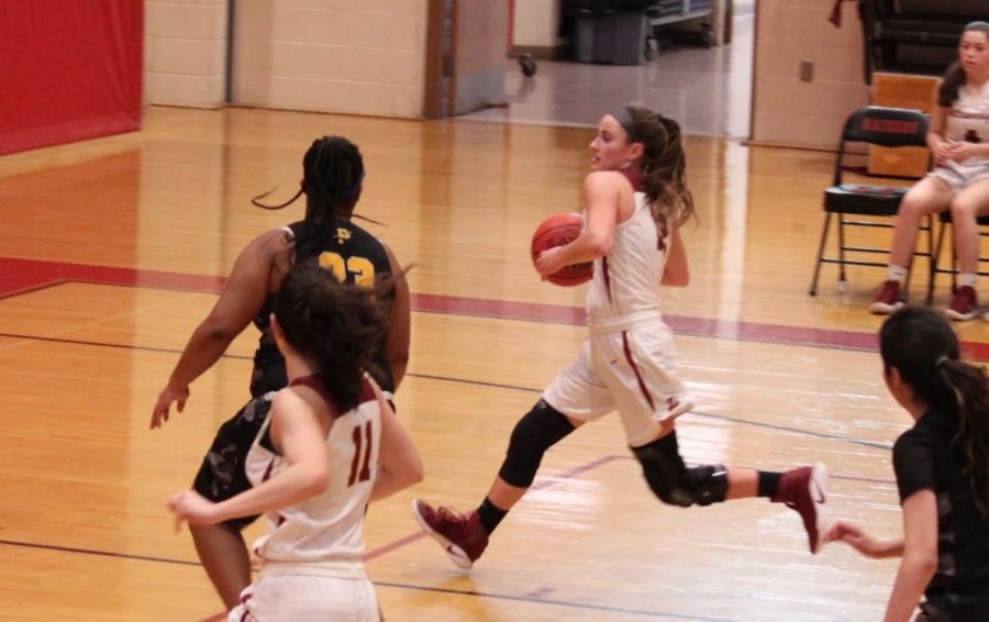 Senior Dani Pescatore drives to the hoop. 