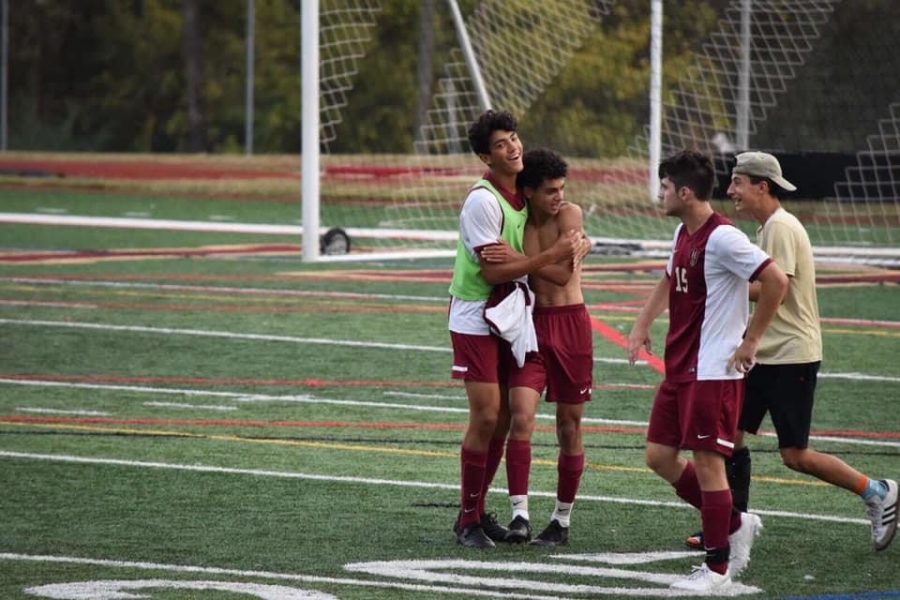 Seniors Alex Cervantes, Adam Sonbol, Brett Smith, and Dimitry Ramirez celebrate a win together.