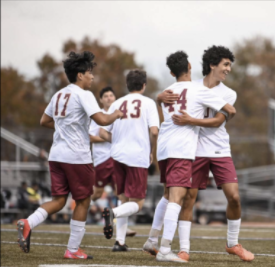 The team celebrates after the Sonbol twins connect for the 6th goal of the game against Philipsburg. 