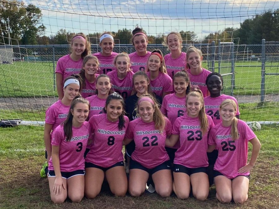 Girls varsity soccer team poses for their team photo.