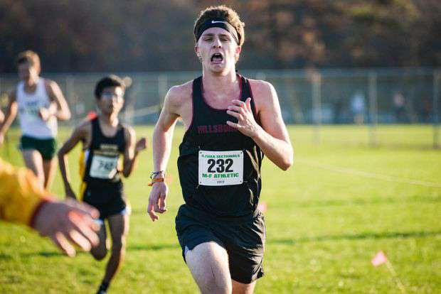 Senior Chris Digricoli sprints to the finish line and achieves a time of 17:16 for the 5-kilometer race. 