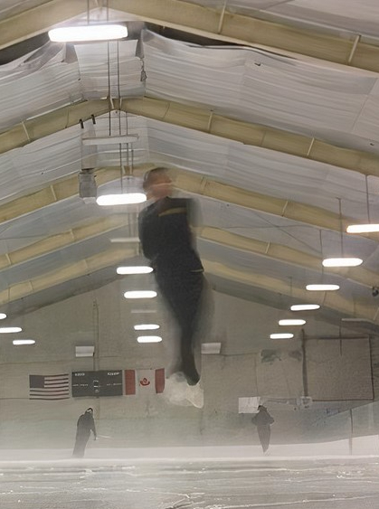 Senior Cindy Dang spins in the air over the ice.