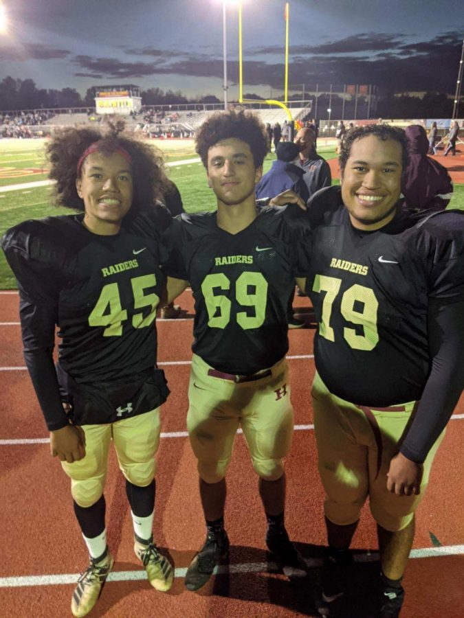 Senior Jordan Nussbaum (left) is accompanied by Nick McGovern (middle) and his twin brother Ryan (right) as they end another game of their senior season. 