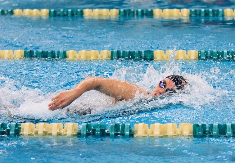 Senior Danielle Dambrosio  warming up in her lane. 