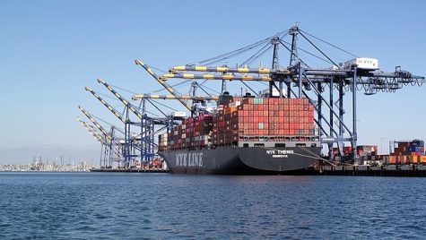 Shipping container ships being unloaded at Los Angeles port.