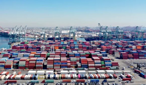 Shipping containers pile up in California ports