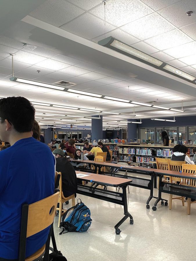 Students eat lunch in the library, another change made to the daily lives of HHS students since the COVID-19 pandemic.