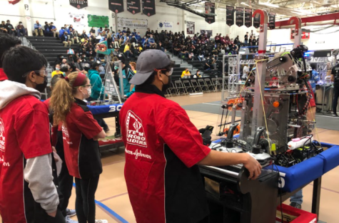 The RoboRaiders Drive Team at the Bridgewater District Competition, preparing for an upcoming match.