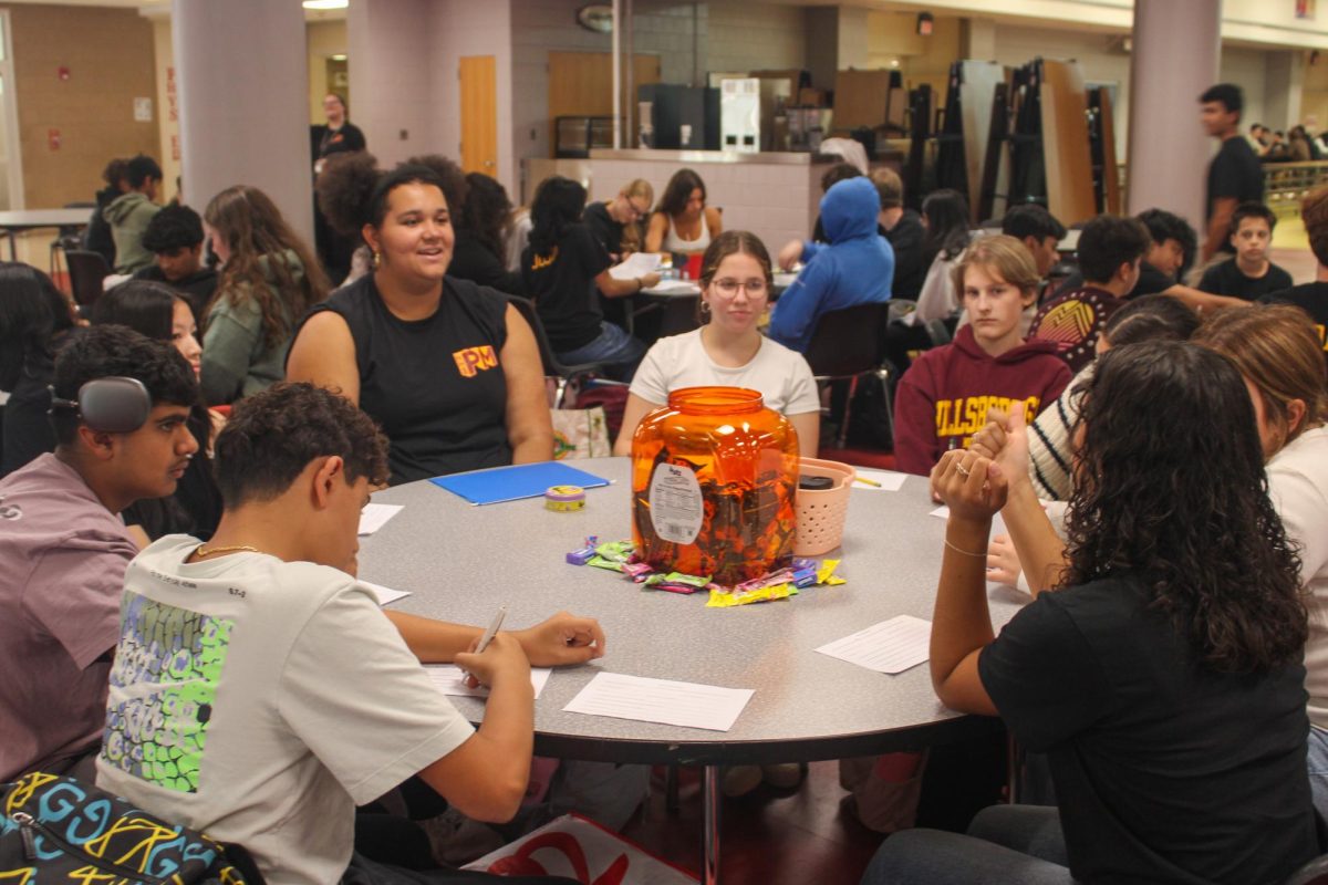 Peer mentors senior Charlotte McLaughlin and junior Cassandra Montoya connect with their freshmen for the first time this school year.