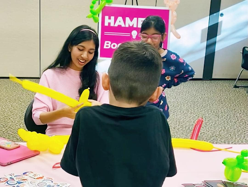 Jannah Hameed twists a yellow balloon at a “Balloons for BOE” meet and greet event at the Hillsborough library.