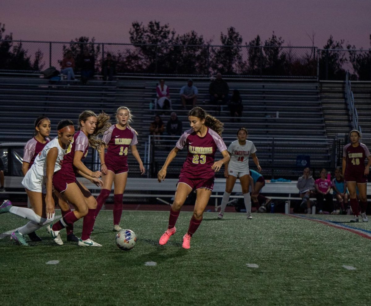 Varsity soccer players move quickly to take control of the game 