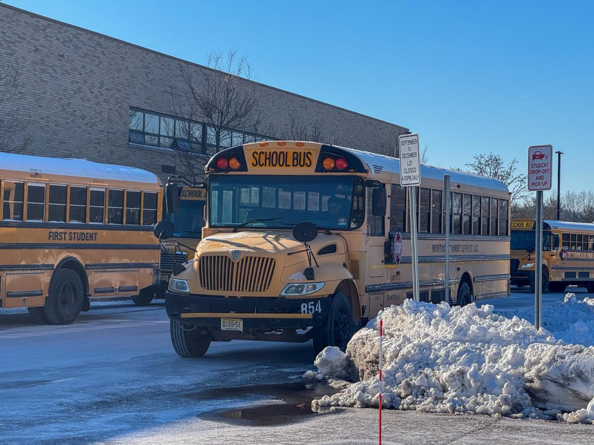 Buses wait at the high school for students to board. The board reinstated courtesy busing after it was cut in 2019 due the budget constraints.