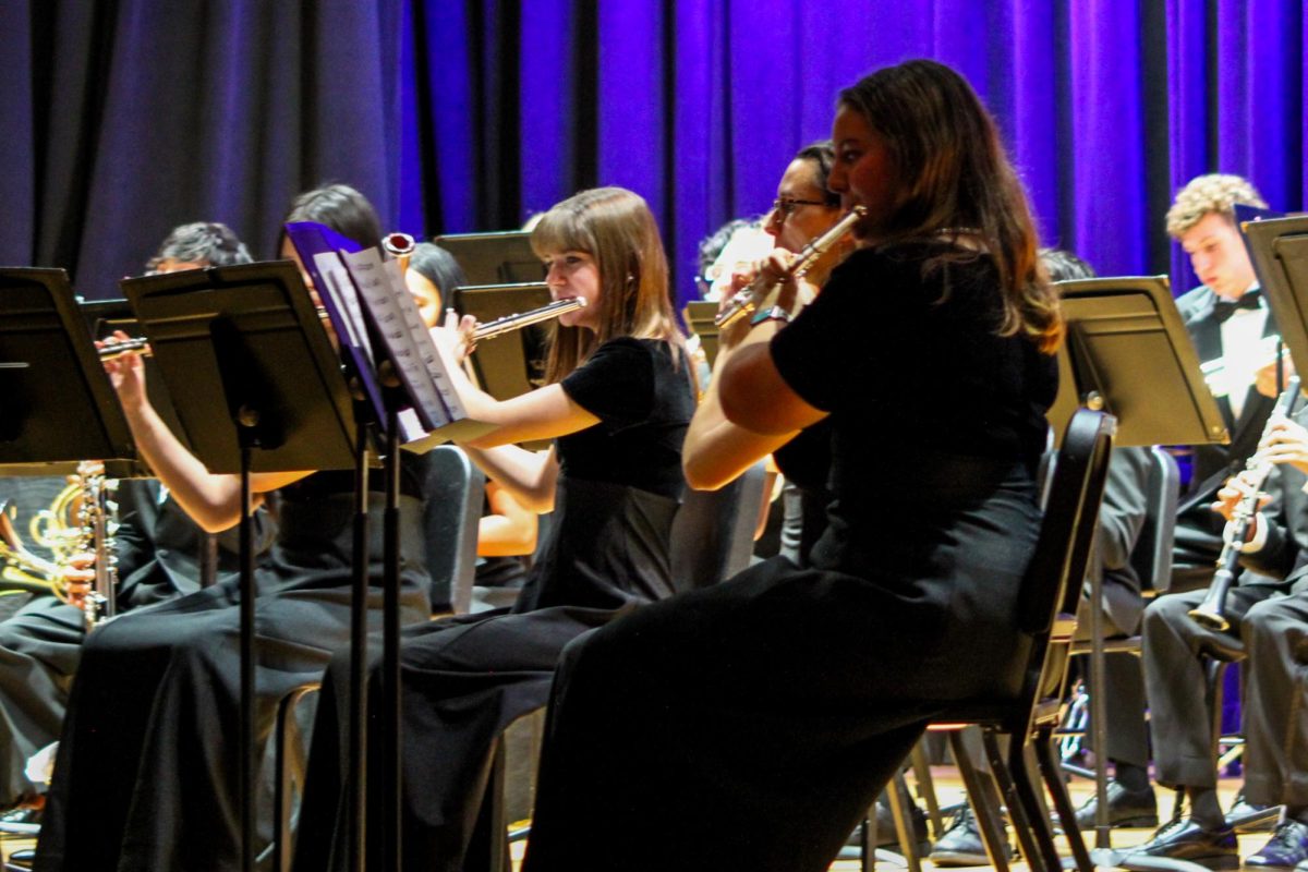 Senior Flutists Gabriella Czechowicz, Isabella Kearney, and Alexa Gibson perform in the Wind Ensemble. 