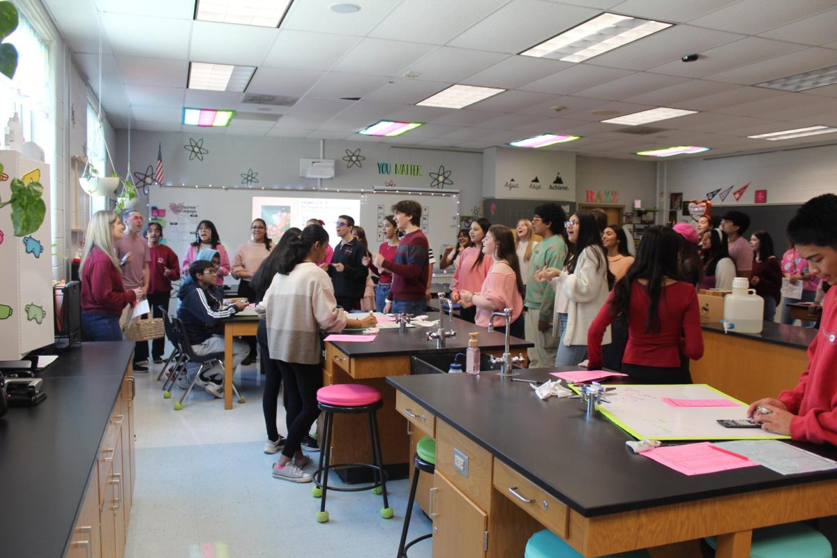 Choir students perform “Can’t Help Falling in Love” for science teacher Ms. Karen Randazzo