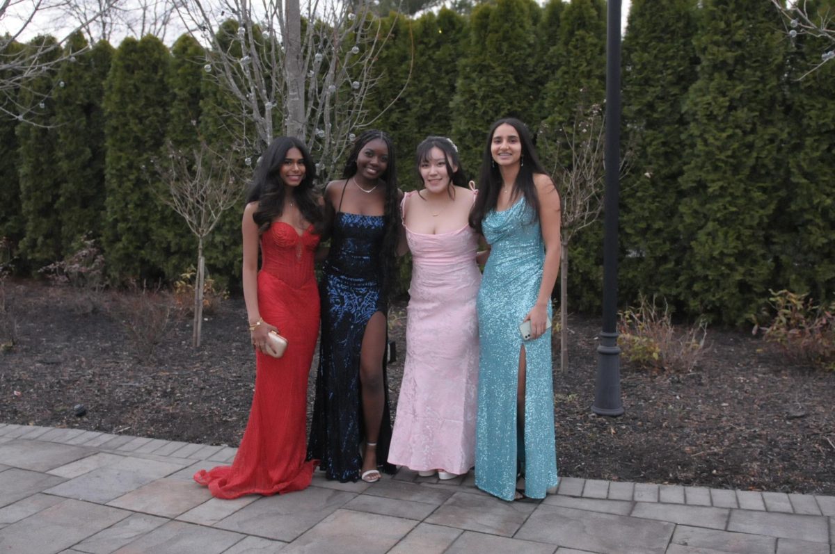 Juniors Anvitha Banda, Louzia Chewaah,
Ariel Martinez, and Neha Dewkar
show off their dresses at Junior Prom.