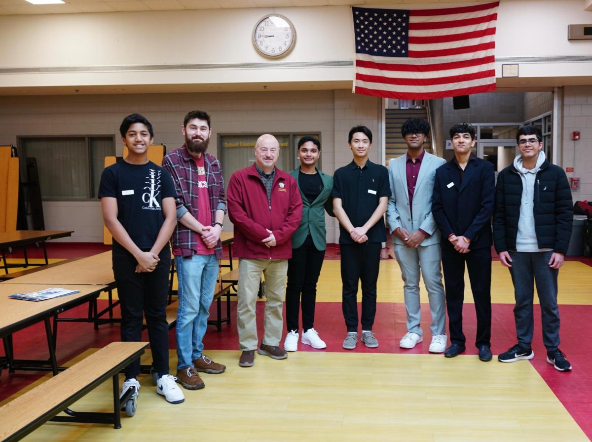 The STEM team stands with adviser Mr. John Askew and Mayor Ciccarelli.