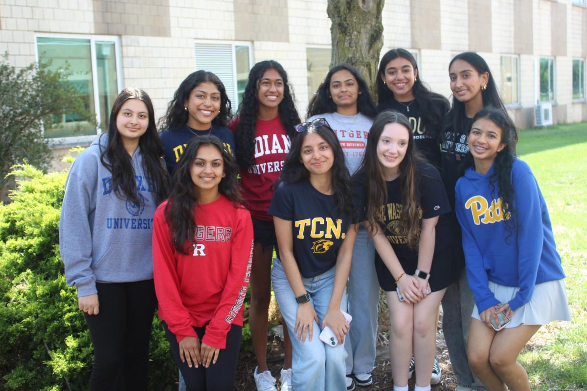 Seniors pose with their friends in their college wear.
