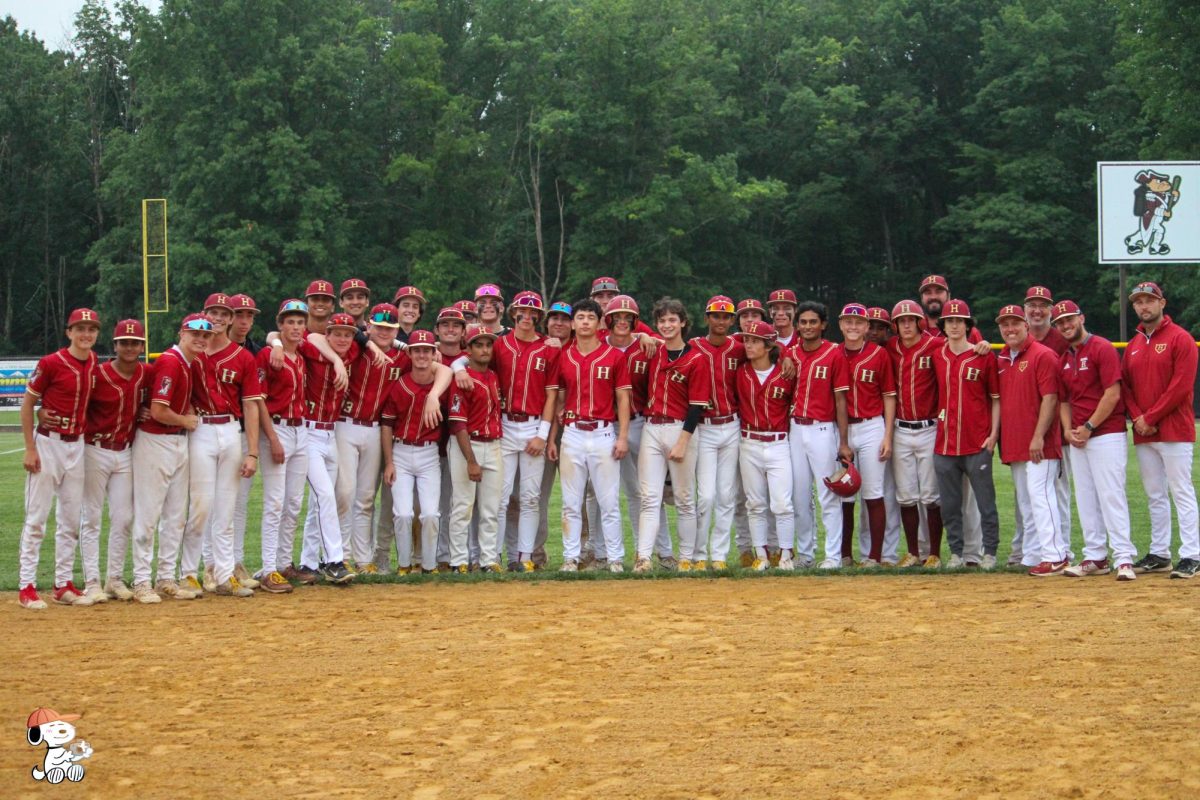 The Raiders Baseball Team pose for a team picture.
