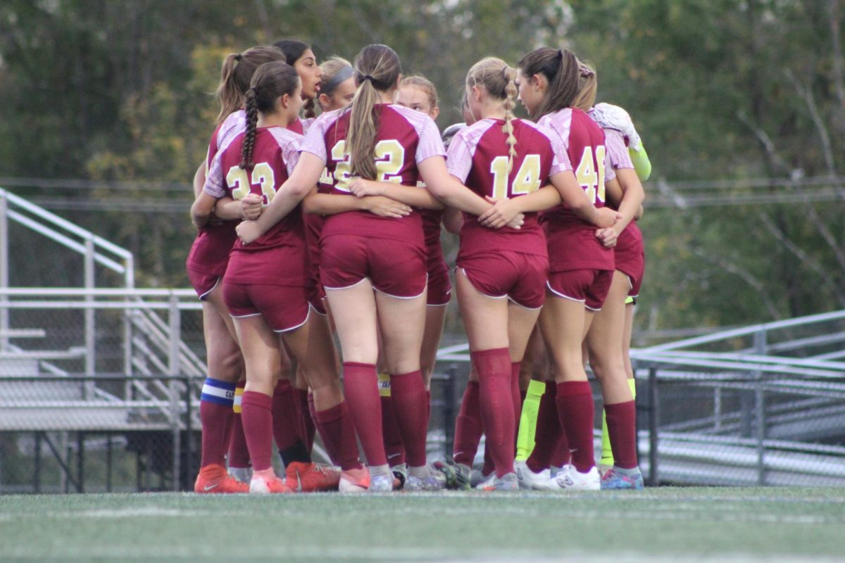 The girls huddle up during their 1-0 win against Somerville during the county championships. 