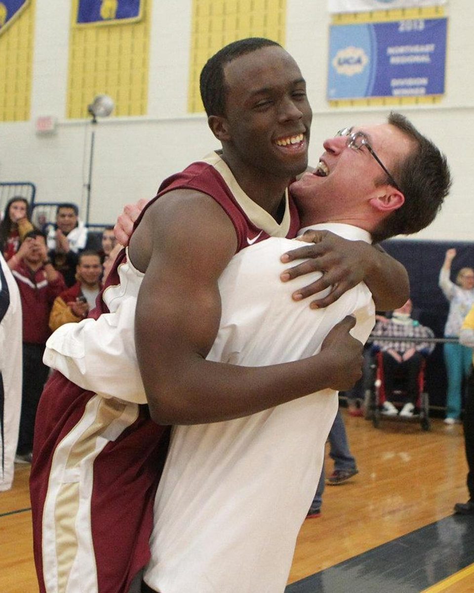 Progin celebrated with James Smith after winning the Somerset County Championship March 1, 2014 when the boys basketball team defeated Gill St. Bernards in overtime.