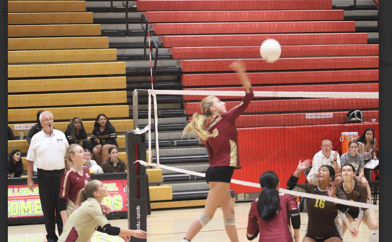 Sophomore Sophia Baraniecki spikes a volleyball to earn a point for Hillsborough in the first set