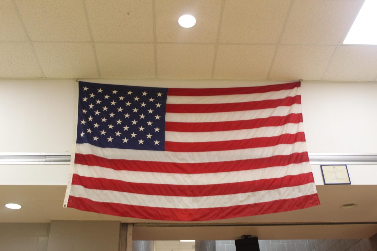 A large flag hangs high in the HHS commons. Its stars and stripes remind us of the beauty of our country and the privilege of our freedoms.