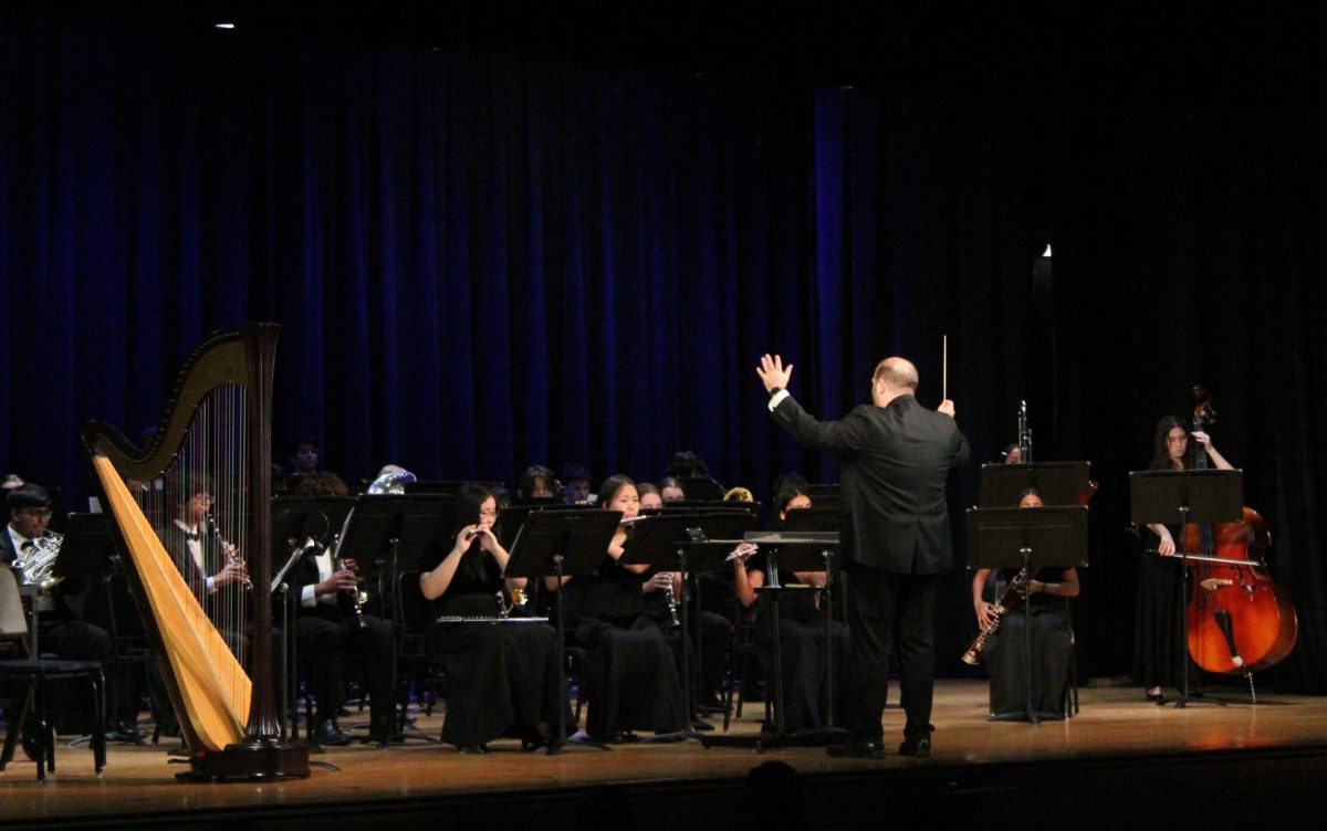 Conductor Nicholas Clipperton leads the Wind Ensemble in its riveting performance of “Sleigh Ride,” written by Leroy Anderson.