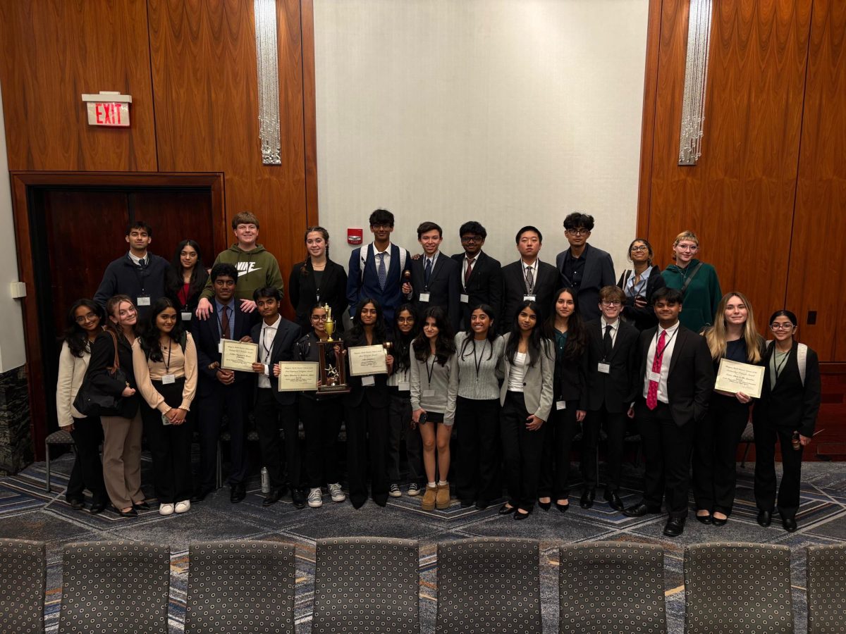 Old and new members of the Debate team gather to showcase their awards earned from the fulfilling weekend.