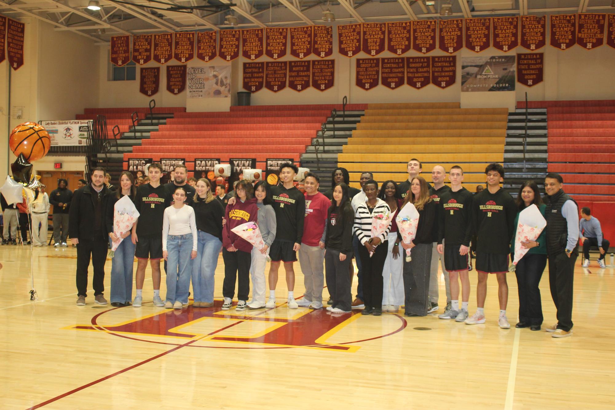 Seniors on Boys Hillsborough Varsity lined up with their family, during a short ceremony in honor of Senior Night Feb. 3.