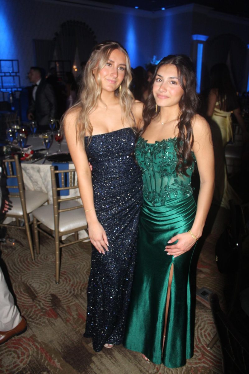 Students Sydney Andreski and Mila Uhrlass pose for a picture at prom.